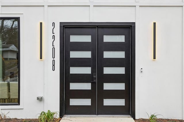 doorway to property with a garage