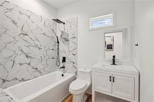 bathroom featuring shower / tub combination, vanity, and toilet