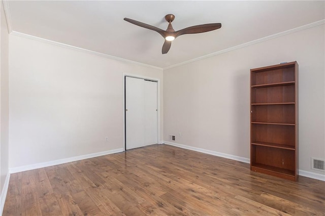 1402 Mclendon Dr, Decatur, GA 30033 - unfurnished room with ornamental molding, a ceiling fan, and wood finished floors