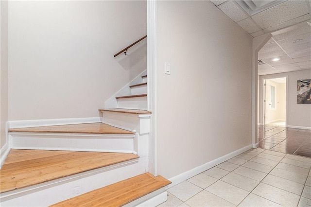 1402 Mclendon Dr, Decatur, GA 30033 - staircase featuring a drop ceiling and tile patterned floors