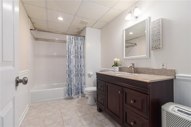 1402 Mclendon Dr, Decatur, GA 30033 - bathroom featuring vanity, shower / bath combo with shower curtain, recessed lighting, wainscoting, and tile patterned flooring