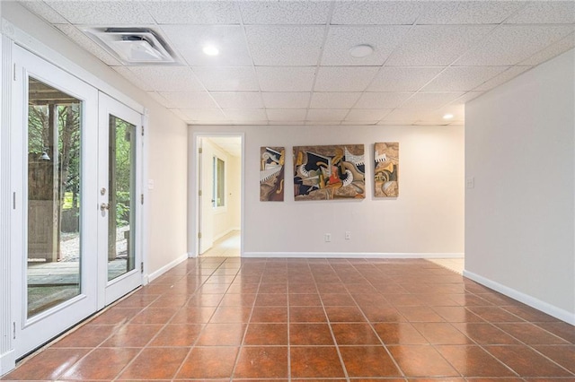 1402 Mclendon Dr, Decatur, GA 30033 - empty room with tile patterned floors and a drop ceiling