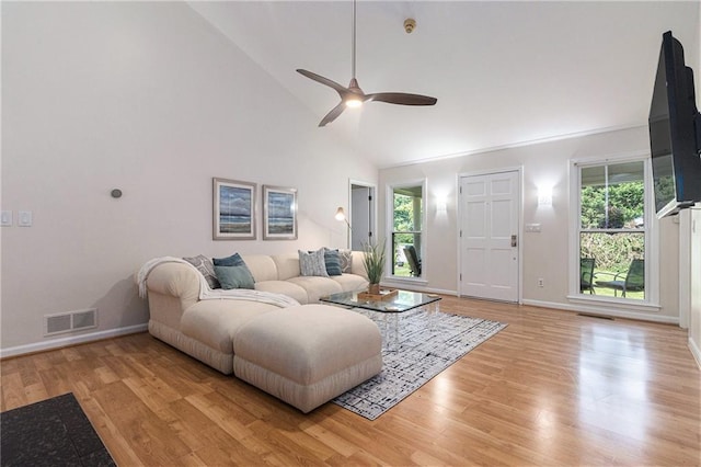 1402 Mclendon Dr, Decatur, GA 30033 - living area featuring ceiling fan, light wood-style flooring, and high vaulted ceiling