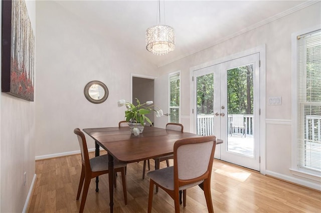 1402 Mclendon Dr, Decatur, GA 30033 - dining area featuring light wood-style flooring, healthy amount of natural light, french doors, a chandelier, and crown molding