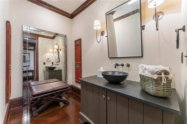 full bathroom with crown molding, vanity, and wood finished floors