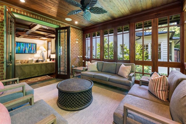 sunroom / solarium featuring coffered ceiling, wood ceiling, a healthy amount of sunlight, and ceiling fan