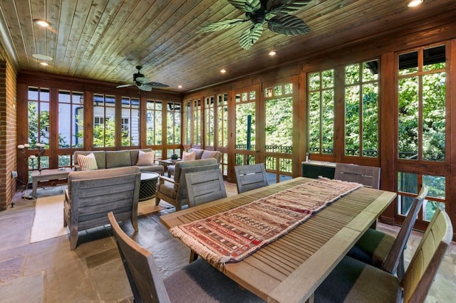 sunroom / solarium with wood ceiling and ceiling fan