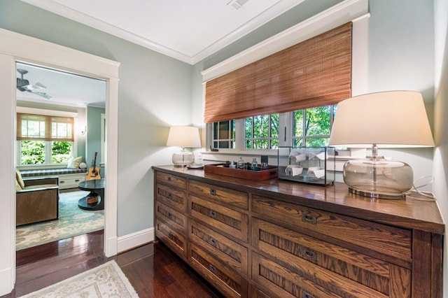 bar with baseboards, dark wood-style flooring, a wealth of natural light, and crown molding