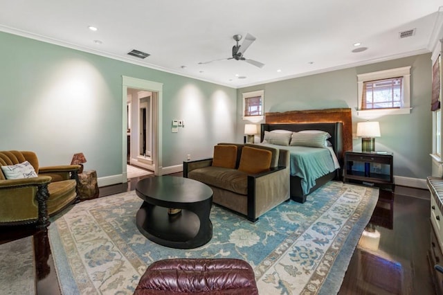 bedroom featuring ornamental molding, visible vents, dark wood finished floors, and baseboards