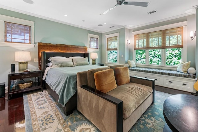 bedroom featuring recessed lighting, wood finished floors, visible vents, and crown molding