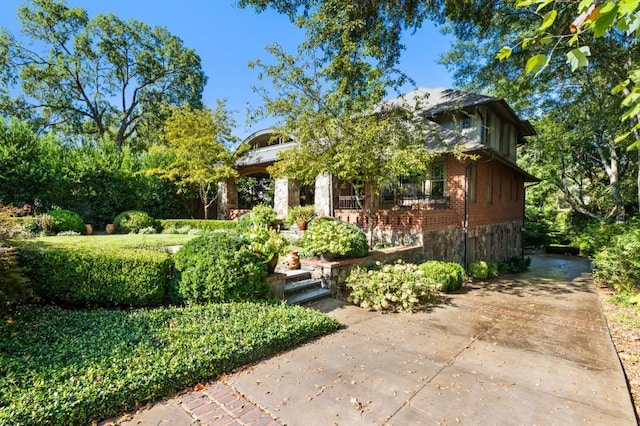 view of front of house featuring brick siding