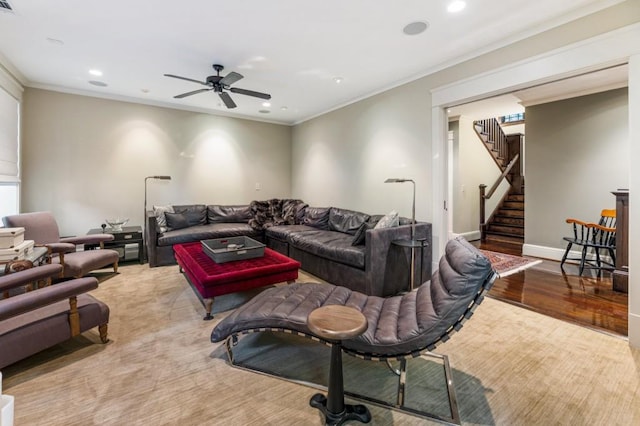 living area with stairs, recessed lighting, baseboards, and crown molding