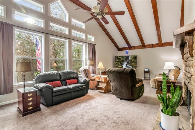 carpeted living room with beam ceiling and high vaulted ceiling