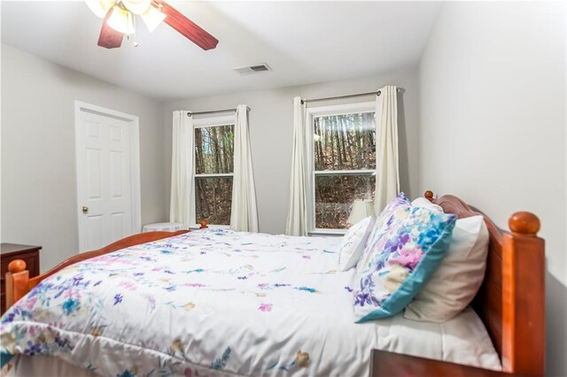 carpeted bedroom with ceiling fan