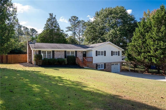 view of front of home with a garage and a front lawn