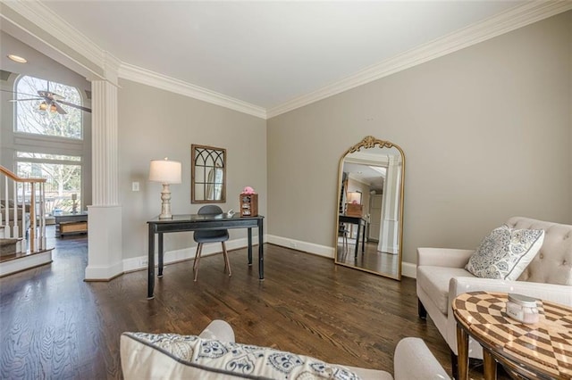 office area with ornate columns, baseboards, wood finished floors, and ornamental molding