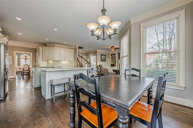 dining room featuring baseboards, dark wood finished floors, stairs, and ornamental molding