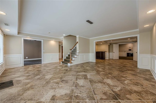 unfurnished living room with visible vents, recessed lighting, and stairway