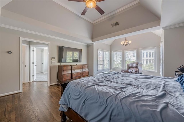 bedroom featuring wood finished floors, visible vents, baseboards, lofted ceiling, and crown molding