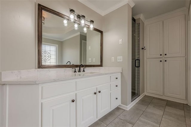 bathroom with a shower stall, ornamental molding, vanity, and tile patterned flooring