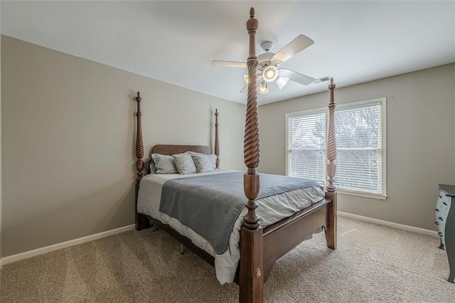 bedroom featuring baseboards, light carpet, and ceiling fan