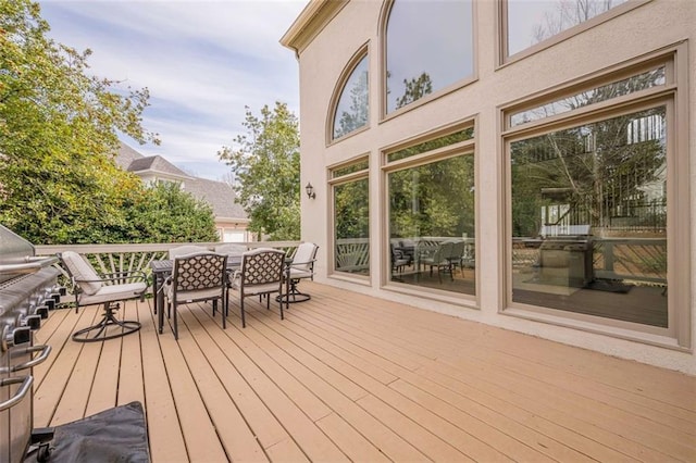 wooden deck with outdoor dining area