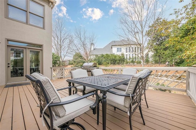 deck with outdoor dining area