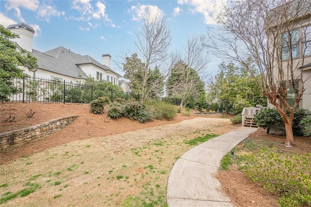 view of yard featuring a deck and fence