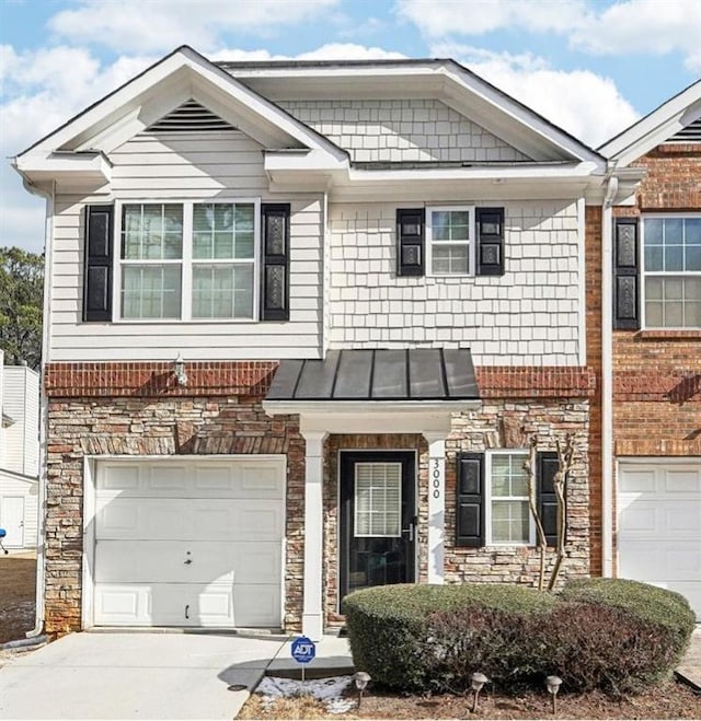 view of front of property with a garage