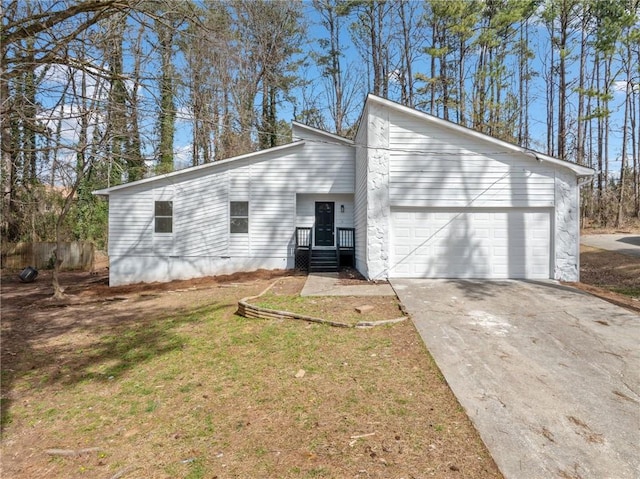 view of property exterior with driveway, a yard, and an attached garage