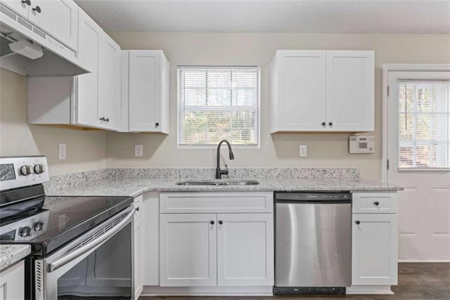 kitchen with sink, white cabinetry, and stainless steel appliances