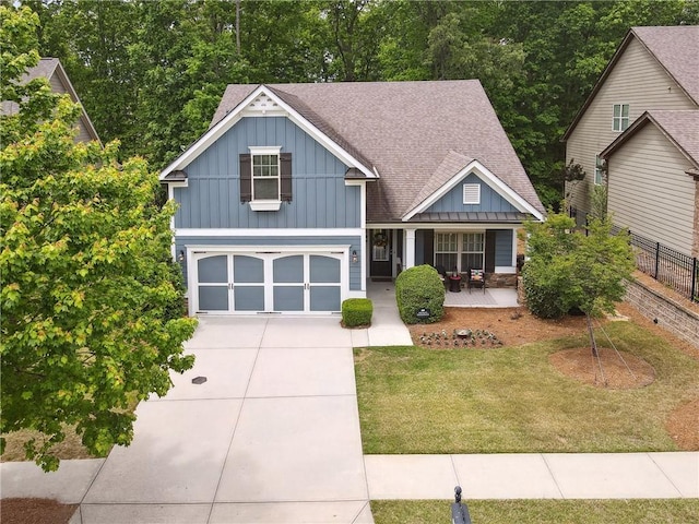 craftsman house with a garage, a front lawn, and a porch