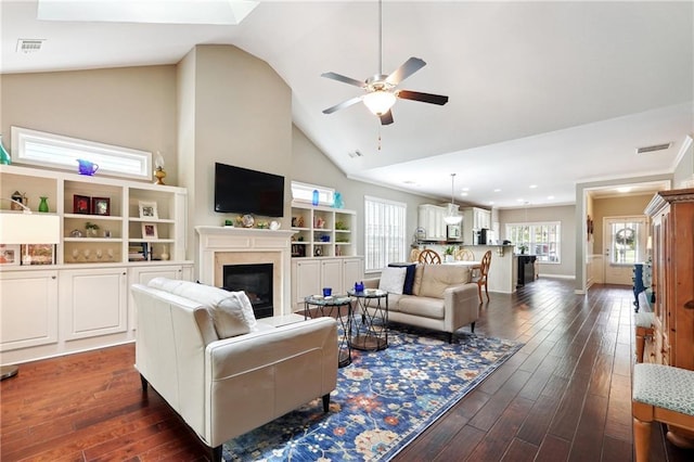 living room featuring high vaulted ceiling, dark hardwood / wood-style floors, and ceiling fan