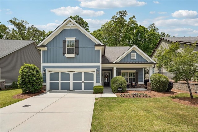 craftsman-style house featuring a garage and a front lawn