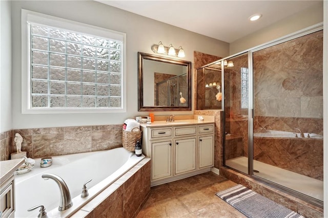 bathroom with tile patterned flooring, vanity, and plus walk in shower