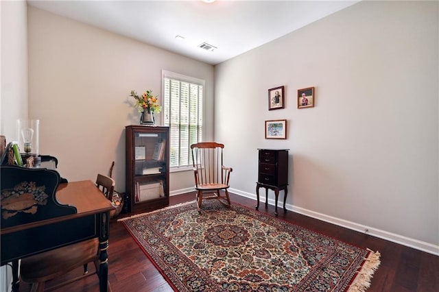 office space with dark wood-type flooring