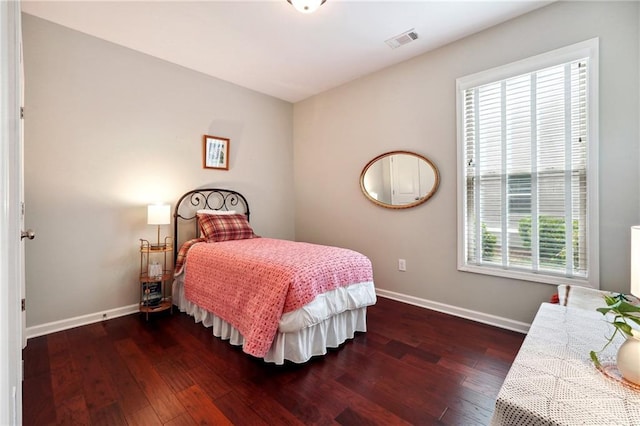 bedroom featuring dark wood-type flooring