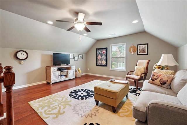 living room featuring hardwood / wood-style flooring, vaulted ceiling, and ceiling fan