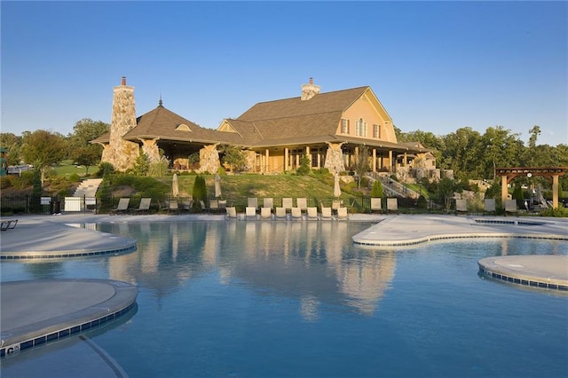 view of pool featuring a pergola and a patio