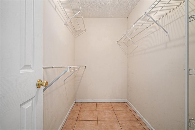 55 Ashland Farm Rd, Oxford, GA 30054 - walk in closet with light tile patterned floors