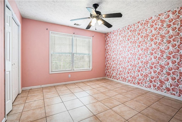55 Ashland Farm Rd, Oxford, GA 30054 - unfurnished bedroom featuring a textured ceiling, a closet, light tile patterned floors, and ceiling fan