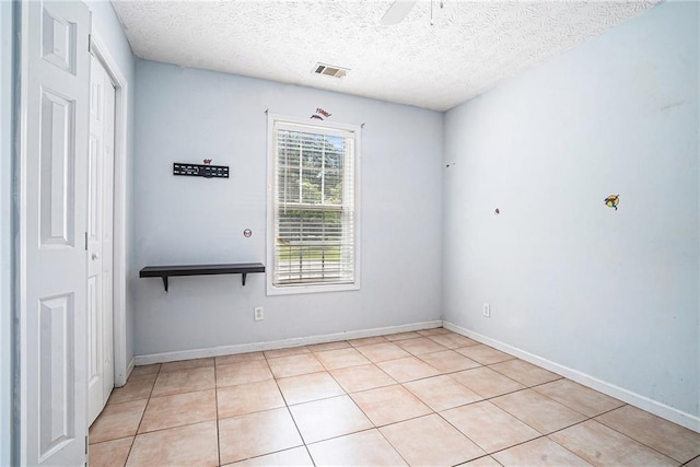 55 Ashland Farm Rd, Oxford, GA 30054 - empty room featuring light tile patterned floors, a textured ceiling, and ceiling fan