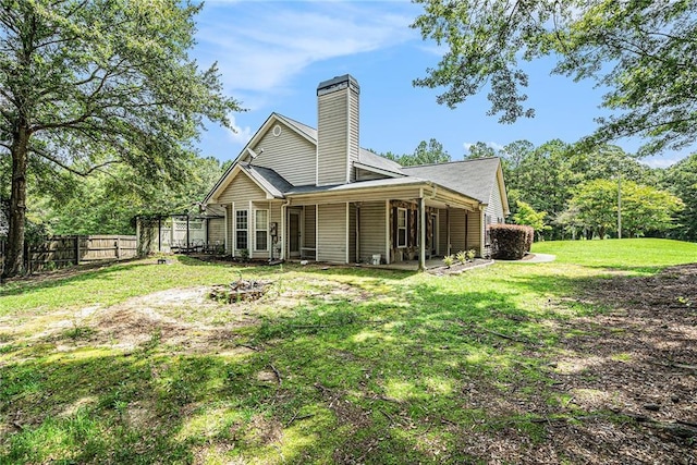 55 Ashland Farm Rd, Oxford, GA 30054 - back of house with a chimney and an outdoor fire pit