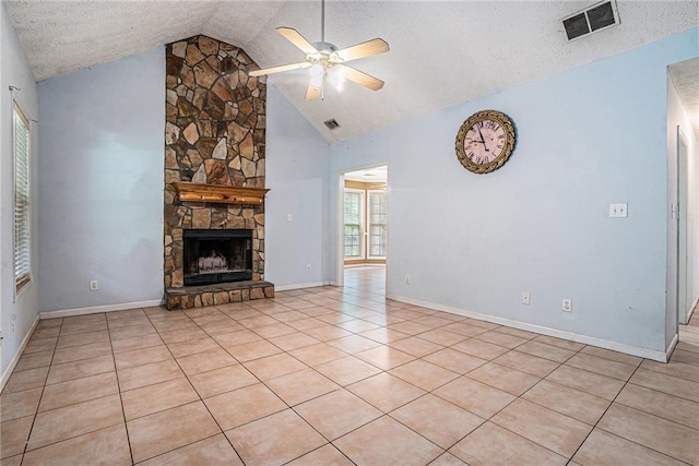 55 Ashland Farm Rd, Oxford, GA 30054 - unfurnished living room featuring a ceiling fan, a fireplace, a textured ceiling, light tile patterned flooring, and high vaulted ceiling