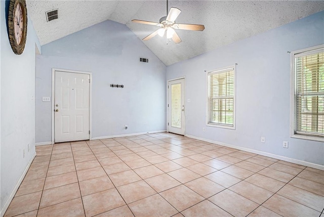 55 Ashland Farm Rd, Oxford, GA 30054 - empty room featuring a ceiling fan, light tile patterned floors, high vaulted ceiling, and a textured ceiling