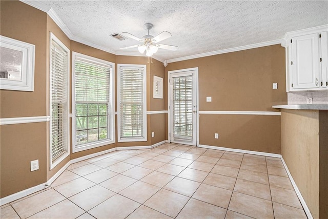 55 Ashland Farm Rd, Oxford, GA 30054 - unfurnished dining area featuring a ceiling fan, light tile patterned floors, crown molding, and a textured ceiling