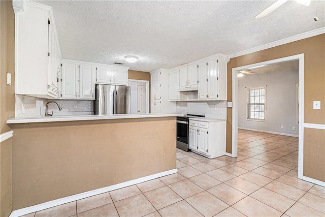 55 Ashland Farm Rd, Oxford, GA 30054 - kitchen featuring appliances with stainless steel finishes, a ceiling fan, a peninsula, decorative backsplash, and light countertops