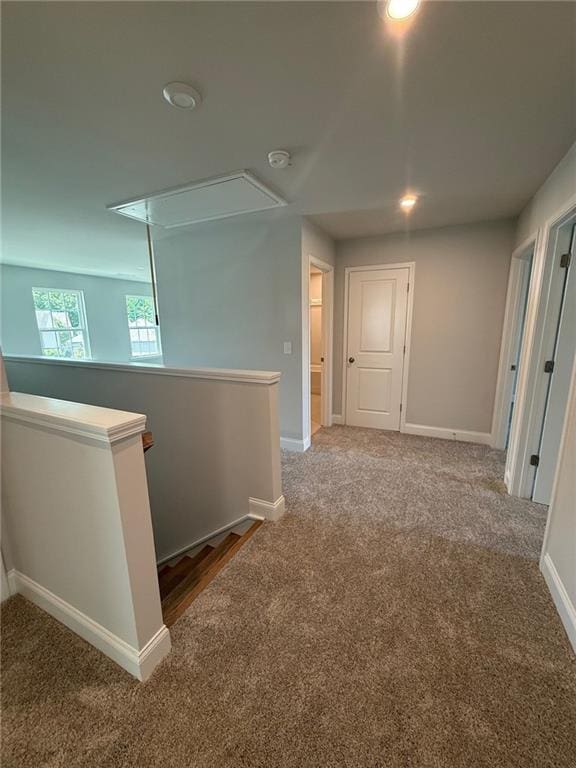 4266 Mulberry Pass Ct, Hoschton, GA 30548 - corridor with attic access, carpet flooring, an upstairs landing, and recessed lighting