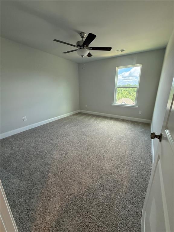 4266 Mulberry Pass Ct, Hoschton, GA 30548 - empty room with carpet floors and a ceiling fan