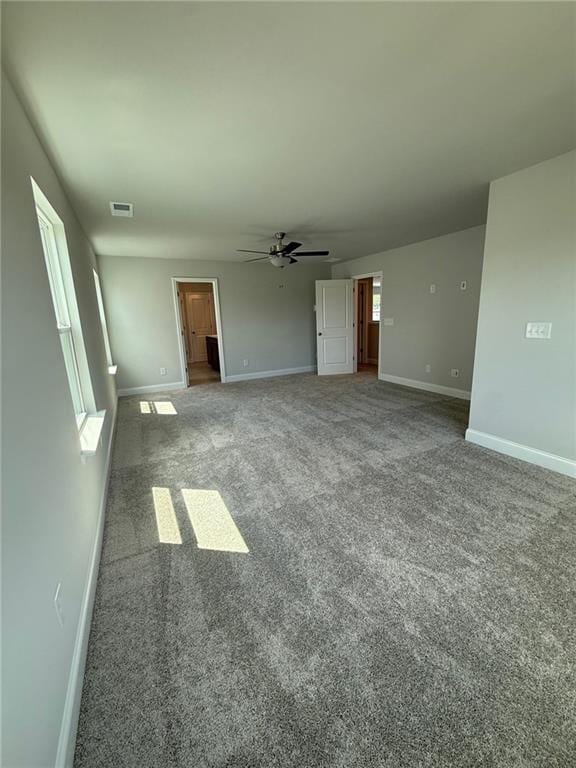 4266 Mulberry Pass Ct, Hoschton, GA 30548 - unfurnished living room with a ceiling fan and carpet